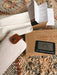 What comes with every pair of GRECH & CO. sunglasses: the gift box, a felt case with a leather tab, a cleaning cloth, the care booklet and a polarization test card
